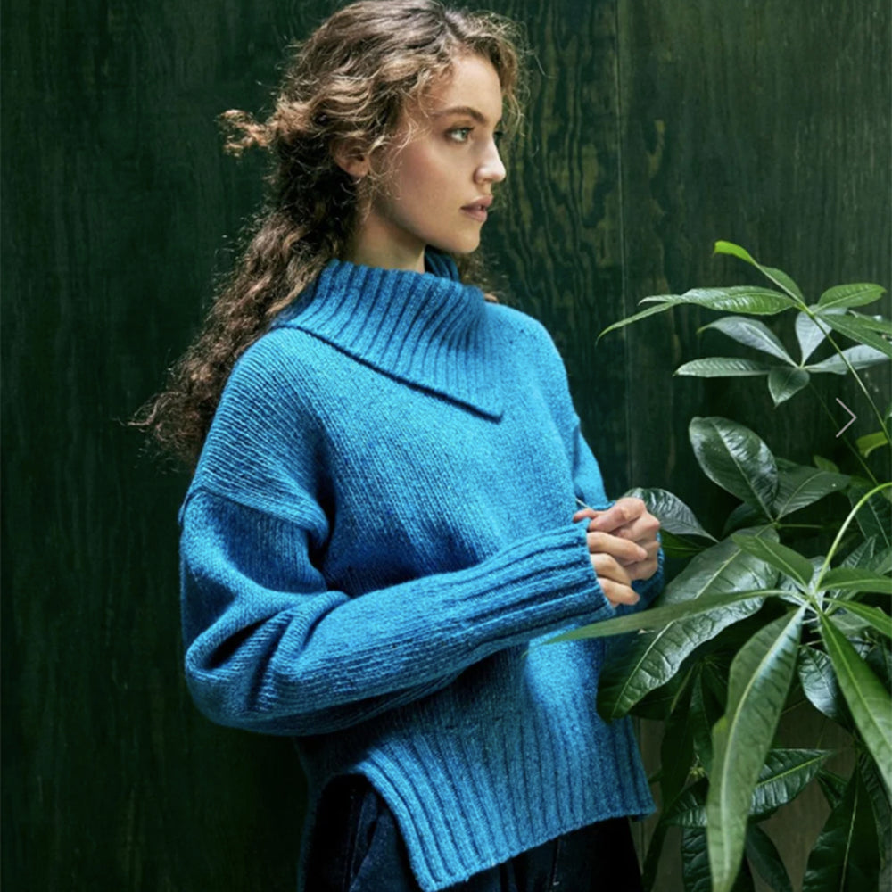 Woman in blue Wilde Funnell Neck Sweater by Ireland's Eye Knitwear